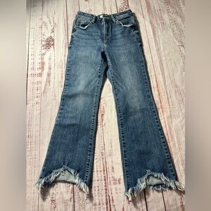 Risen crop Blue Denim Jeans with raw hem.